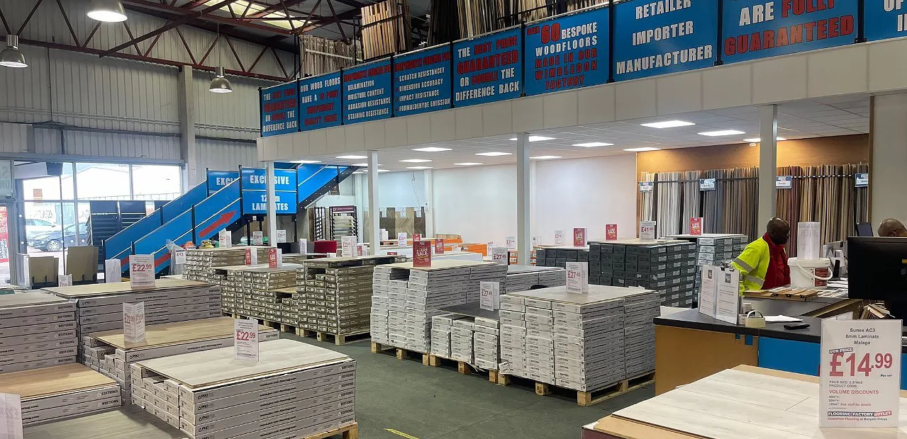 Inside the Flooring Factory Outlet showroom in Croydon, showcasing a diverse range of flooring options including wood flooring, click vinyl flooring, and flooring accessories.