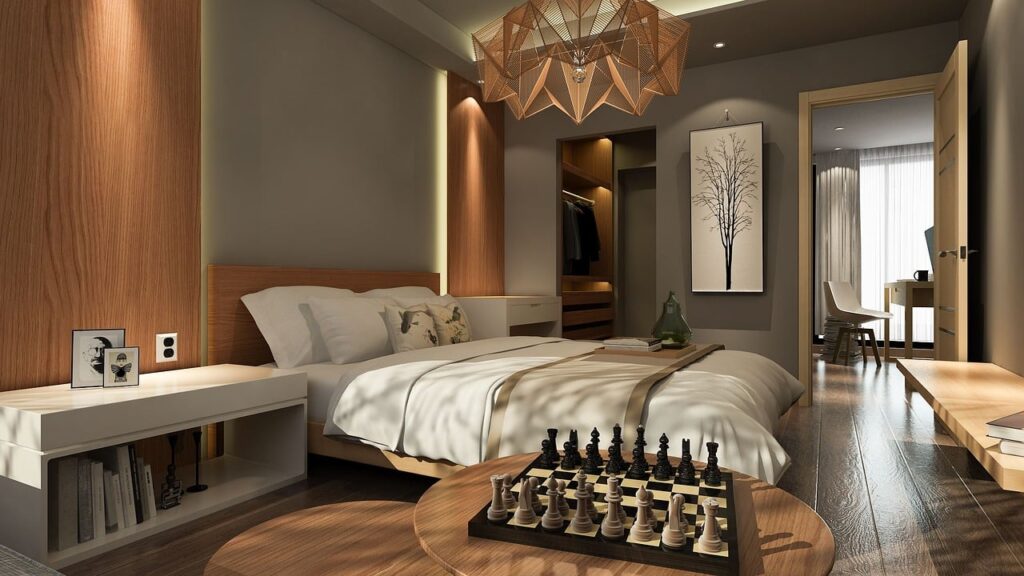 Modern bedroom with engineered wood flooring designed to reduce noise transmission, showcasing a cosy and tranquil space with soft lighting and stylish decor.